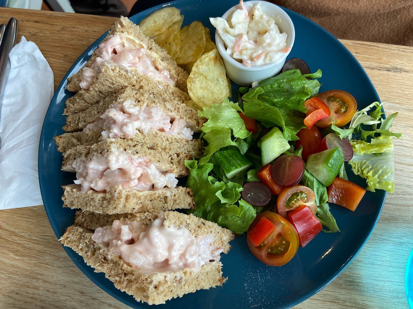 Four prawn sandwiches, with crisps, salad and coleslaw on the side. Enjoy breakfast or lunch at our café in Teignmouth!