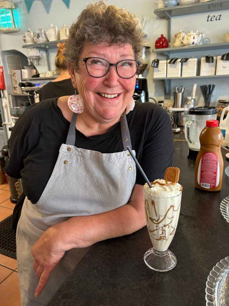 Member of staff preparing a delicious drink. Contact Us Today!